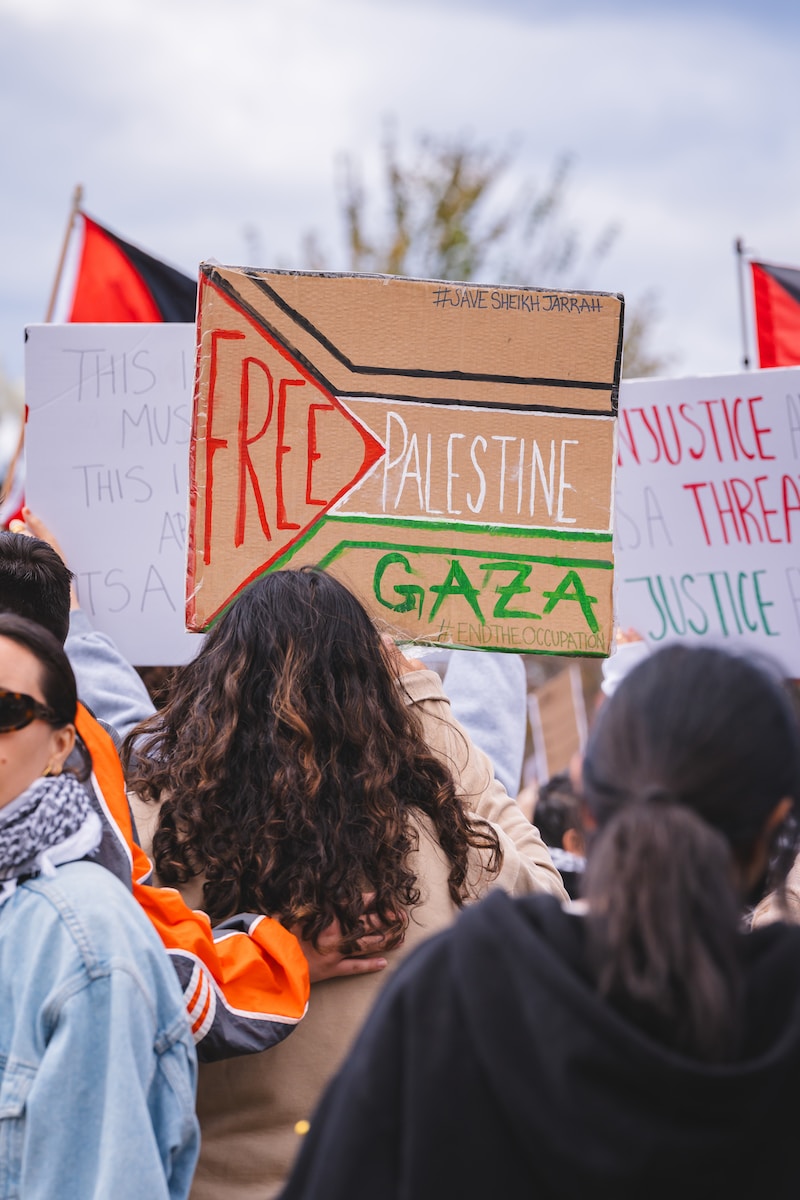 a group of people holding signs in a protest